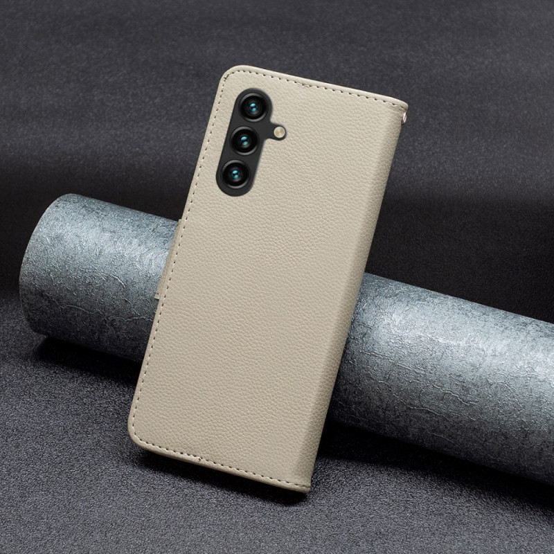 Fliptok Samsung Galaxy A15 Licsi Bőr Stílusú Szíjjal